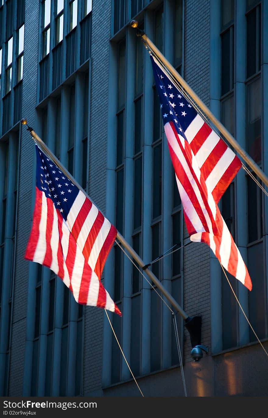 American flags hanging from the side of a building