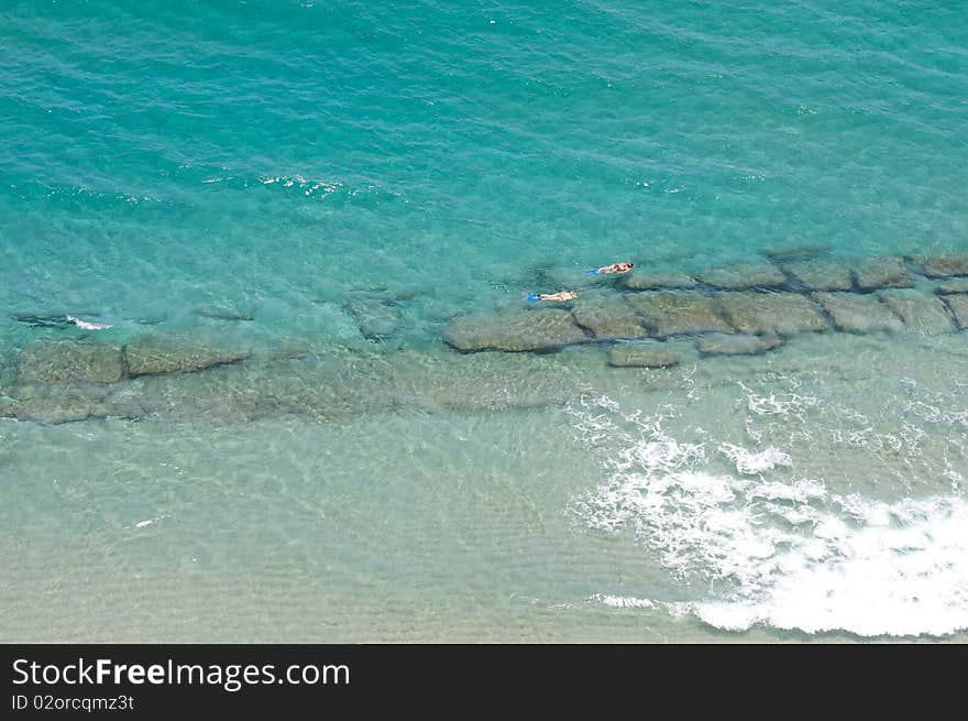 Girls Snorkeling In The Ocean