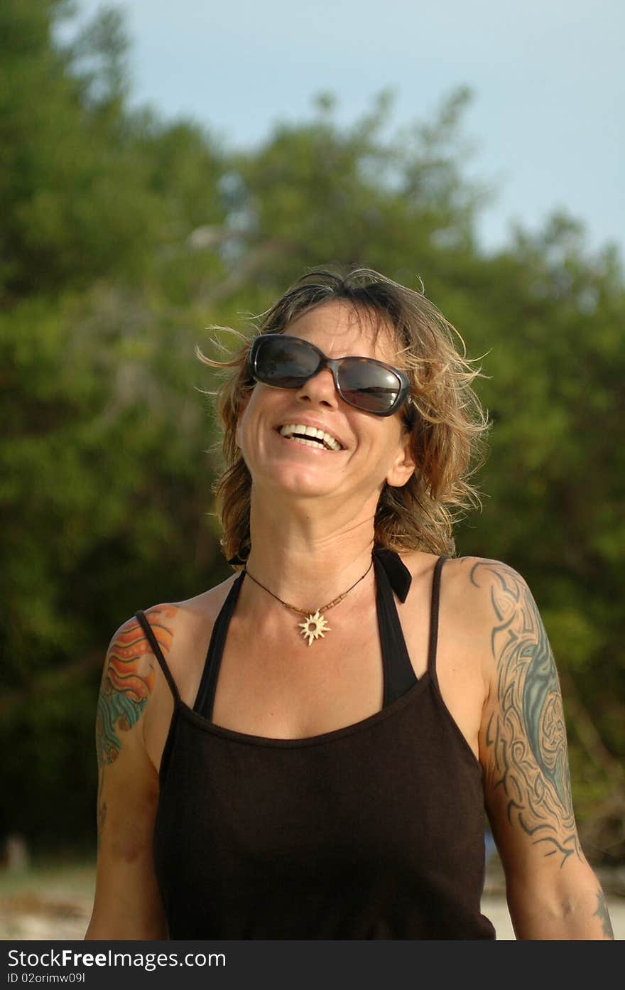 Happy tattoo woman