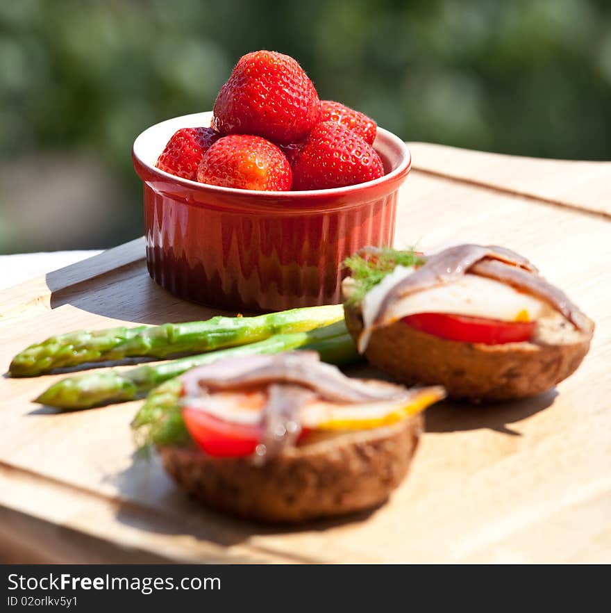 Strawberry and anchovy sandwich and asparagus. Strawberry and anchovy sandwich and asparagus