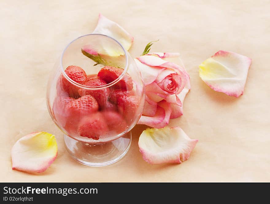 Flaming Strawberry in growing misted glass and ailing rose. Flaming Strawberry in growing misted glass and ailing rose