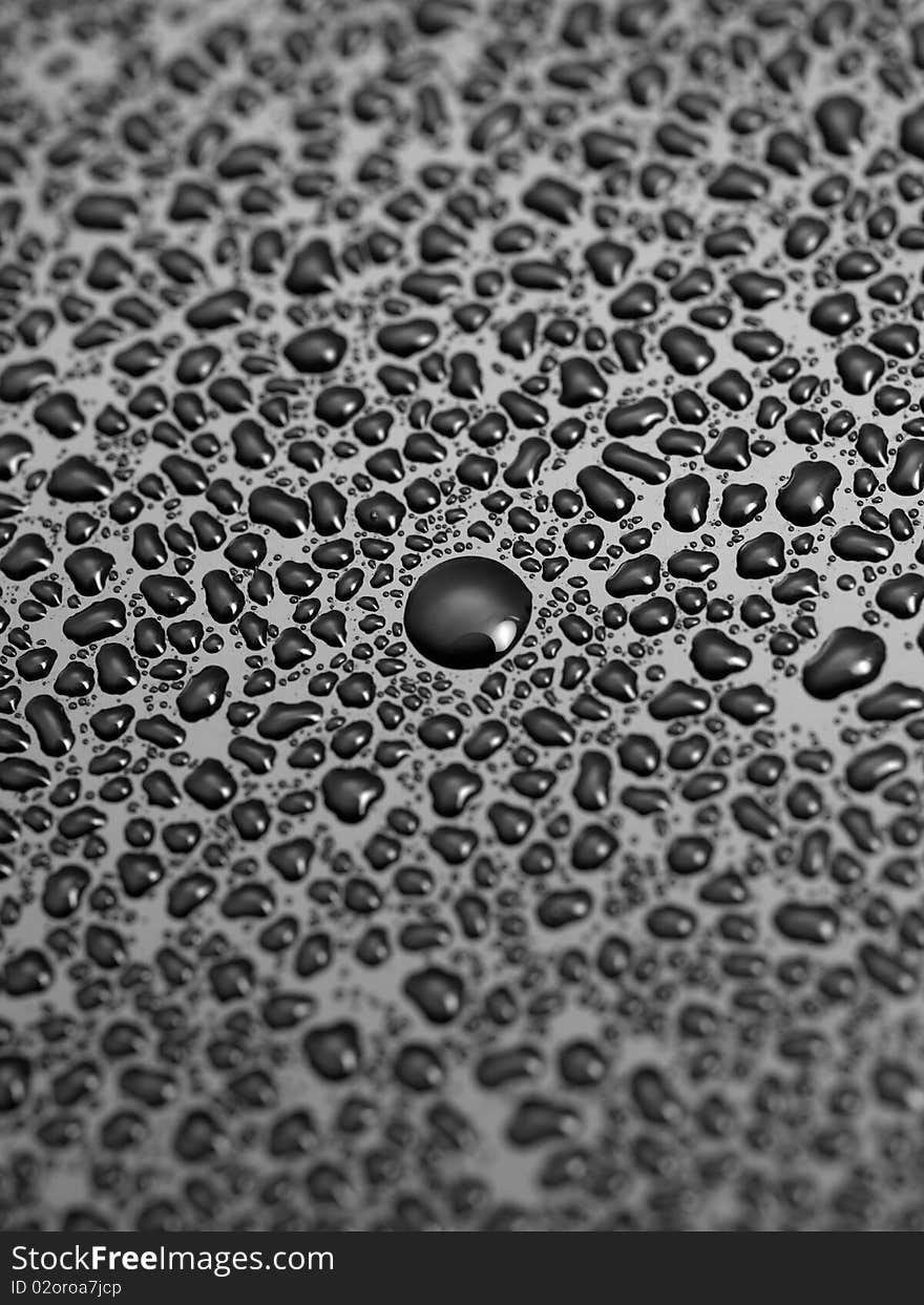 Water droplets isolated on a black surface