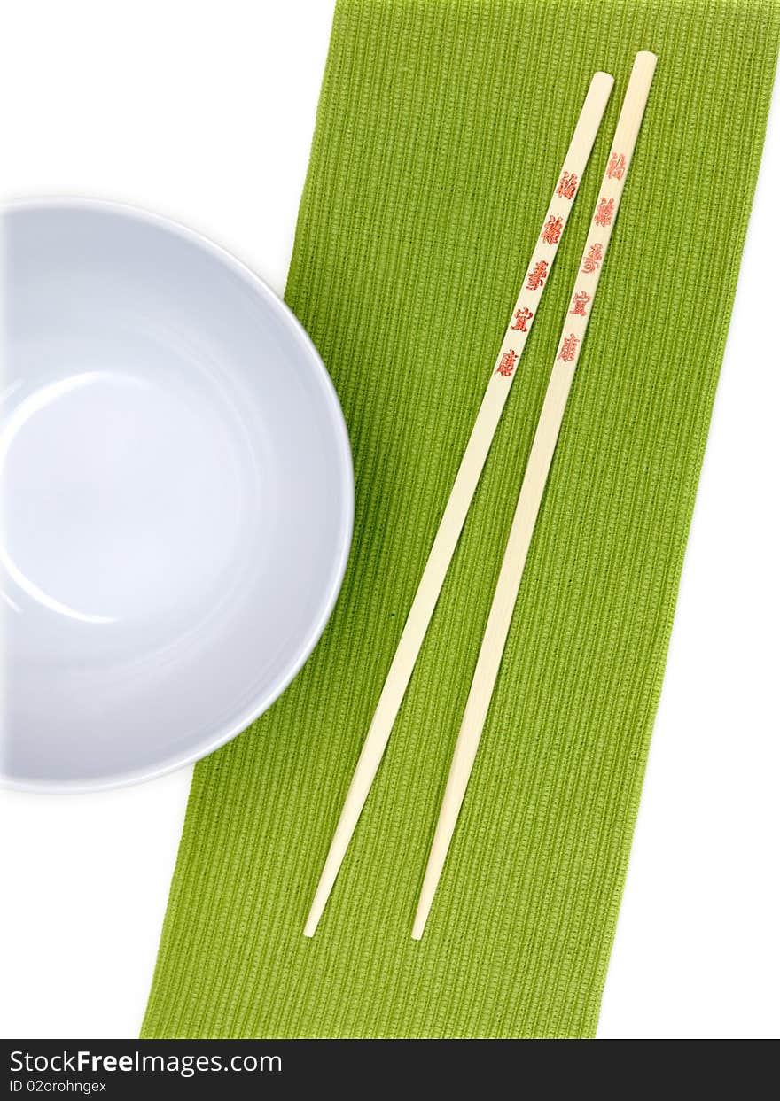 Chop sticks on a noodle bowl on a kitchen bench. Chop sticks on a noodle bowl on a kitchen bench