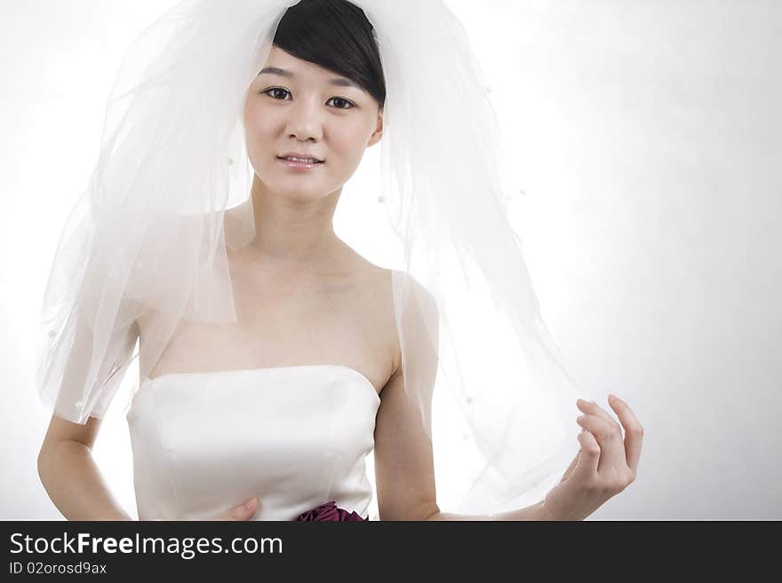 Beautiful bride with perfect natural makeup,smiling,wearing mantilla