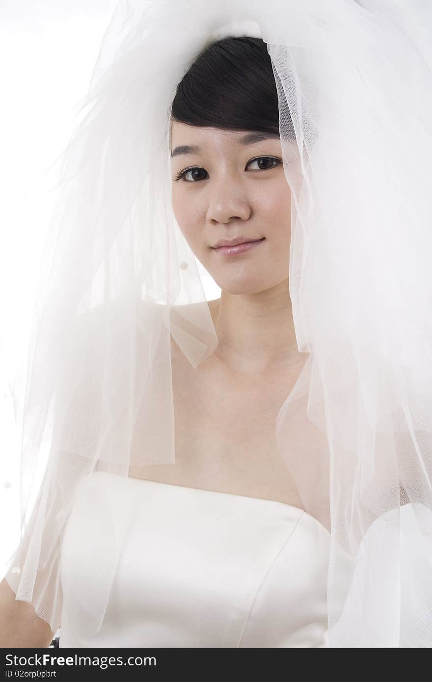 Beautiful bride with perfect natural makeup,smiling,wearing mantilla