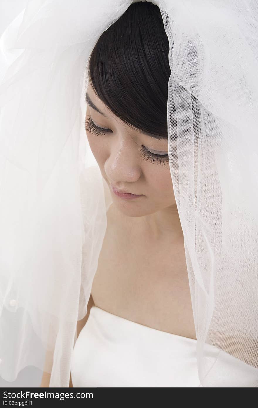 Beautiful bride with perfect natural makeup,smiling,wearing mantilla