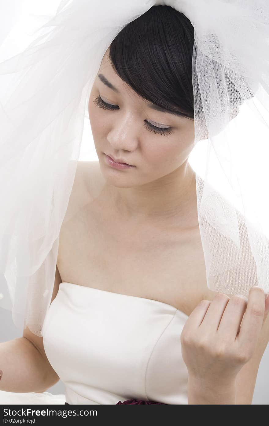 Beautiful bride with perfect natural makeup,smiling,wearing mantilla