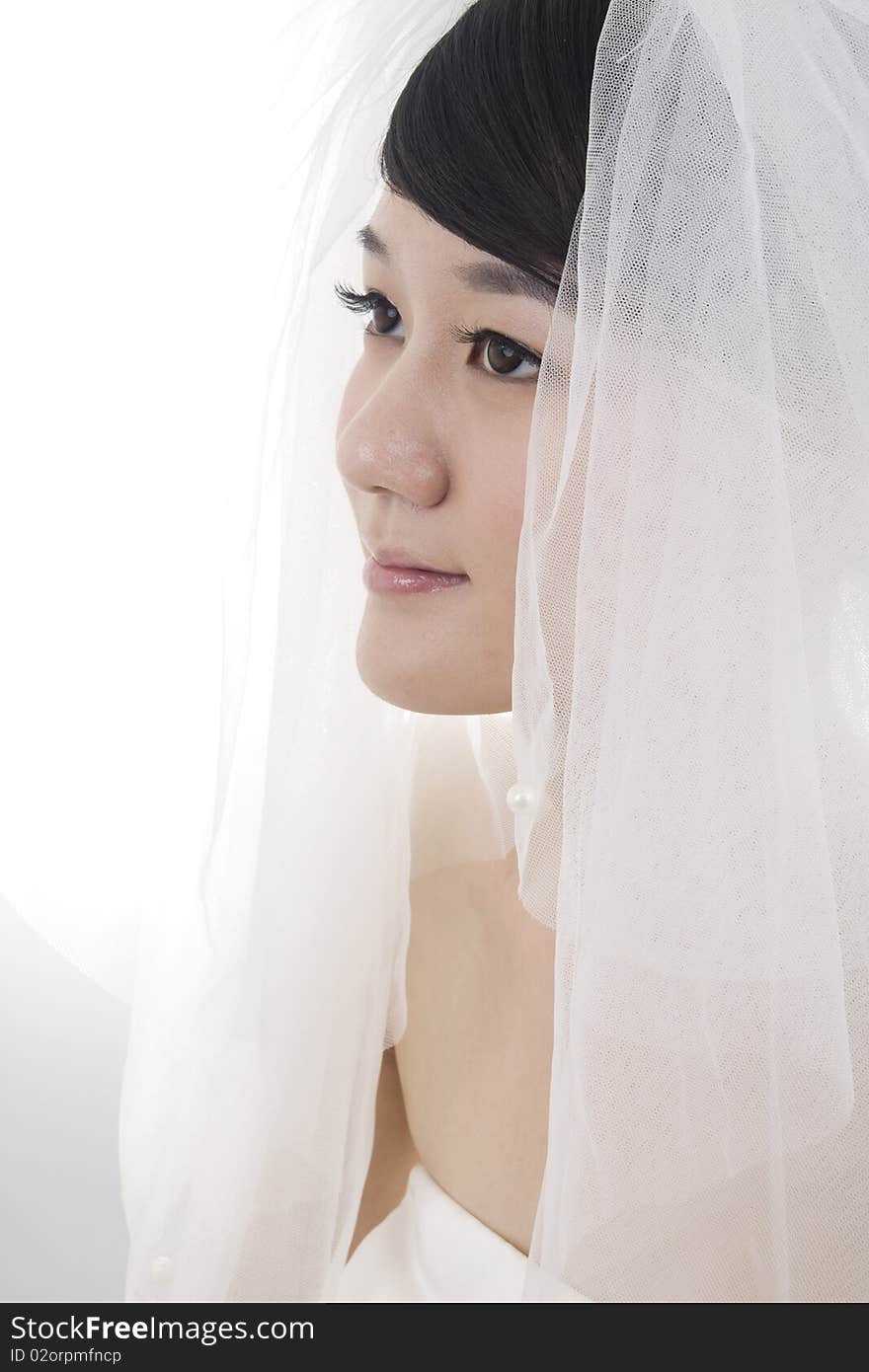 Beautiful bride with perfect natural makeup,smiling,wearing mantilla