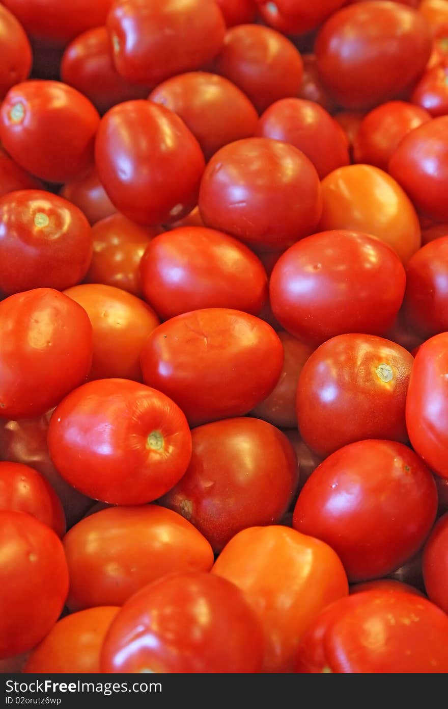 Red and ripe tomatoes in a farmers' market. Red and ripe tomatoes in a farmers' market