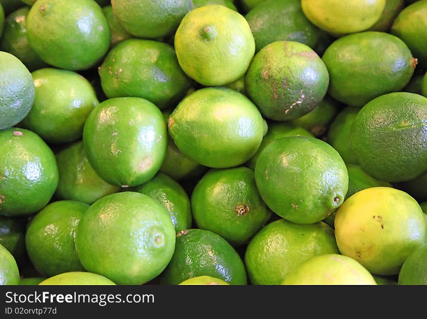 Limes in bunches at a farmers' market. Limes in bunches at a farmers' market