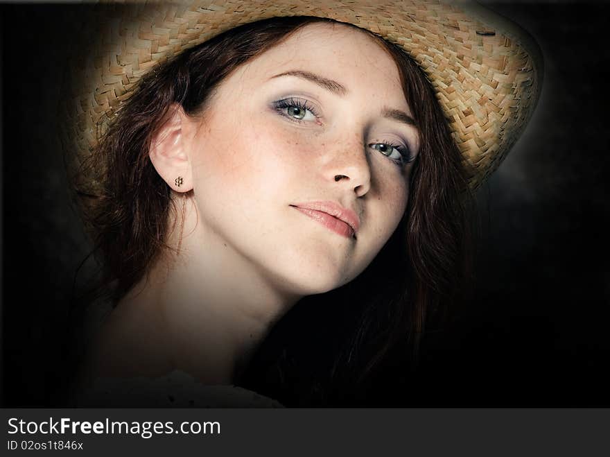 Young woman in a country hat. Young woman in a country hat