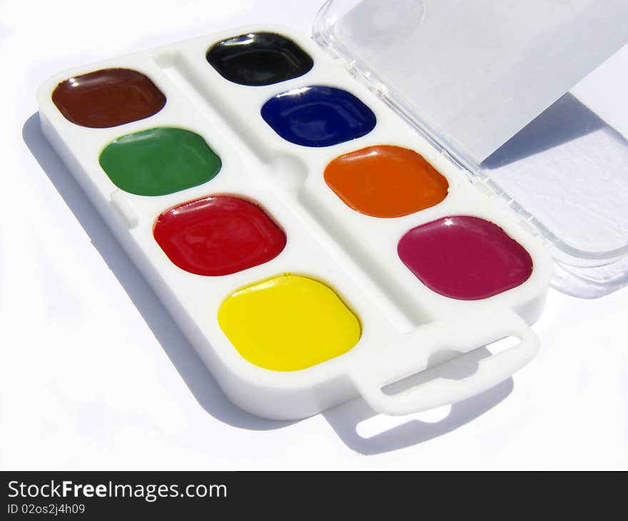 Water colours in a child's paint box.