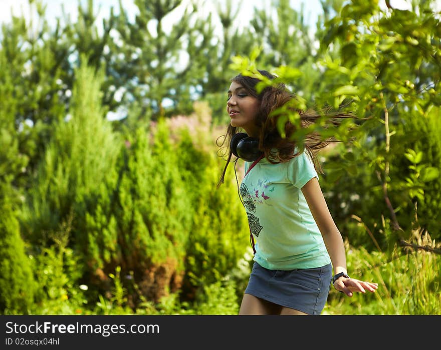 Young beautiful girl dancing outdoor