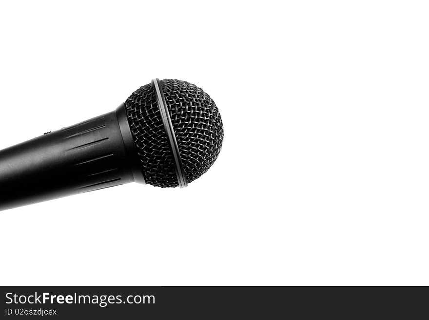 A black microphone on an isolated white background. A black microphone on an isolated white background