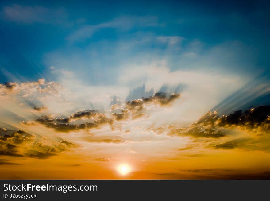 Decline in clouds of the sun with beams background. Decline in clouds of the sun with beams background