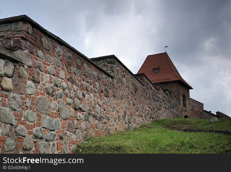 Ancient fortification on a thunder-storm sky background