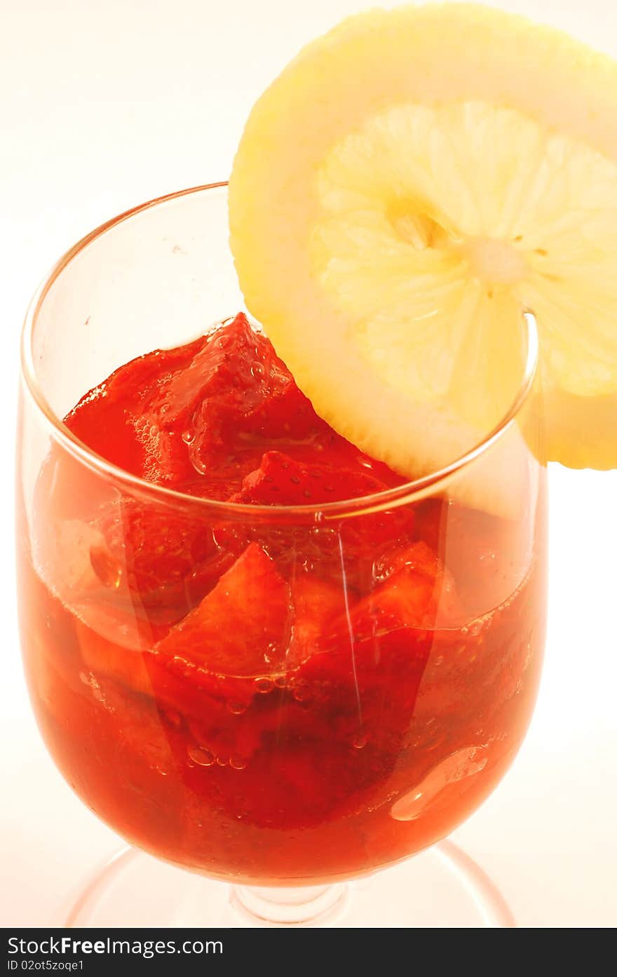 A cup of strawberries seasoned with lemon and sugar. A cup of strawberries seasoned with lemon and sugar