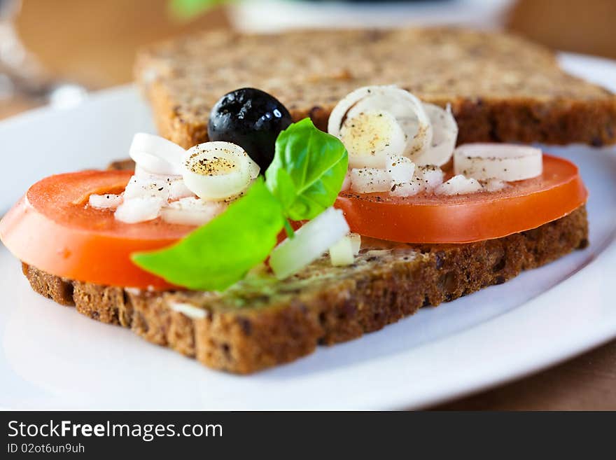 Canape with tomato,olives and onion. Canape with tomato,olives and onion