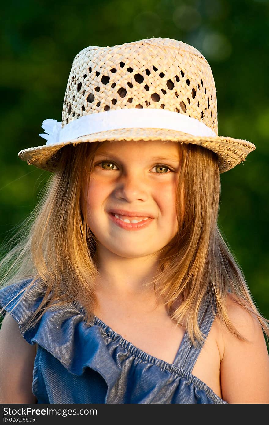 Portrait of beautiful girl in straw hat at the sunshine. Portrait of beautiful girl in straw hat at the sunshine.