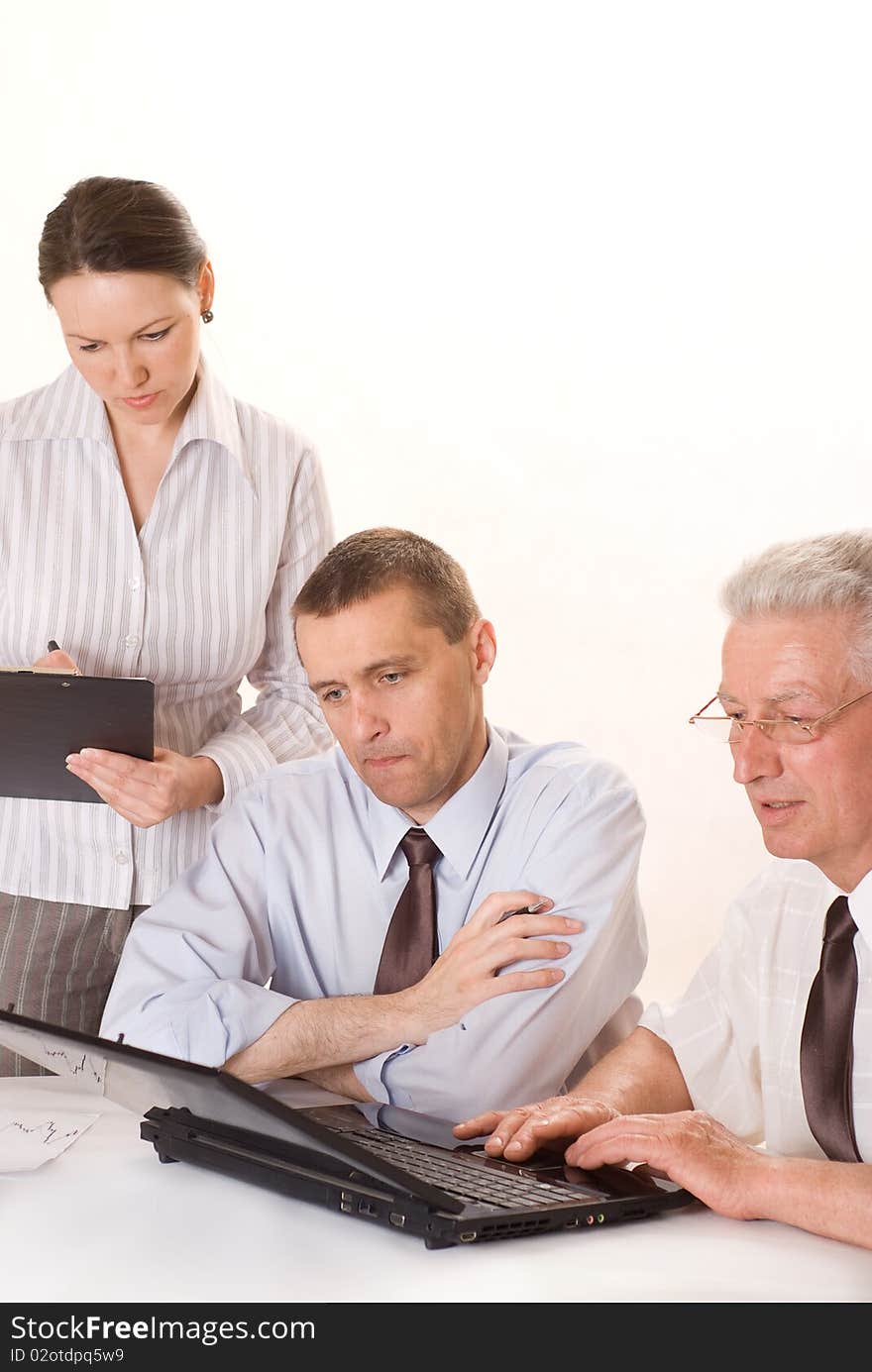 Two businessmen working together on a white