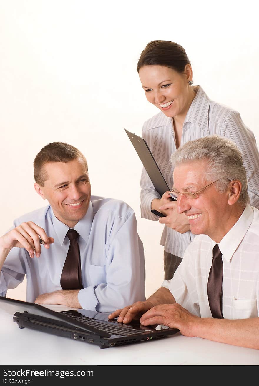 Two businessmen working together on a white