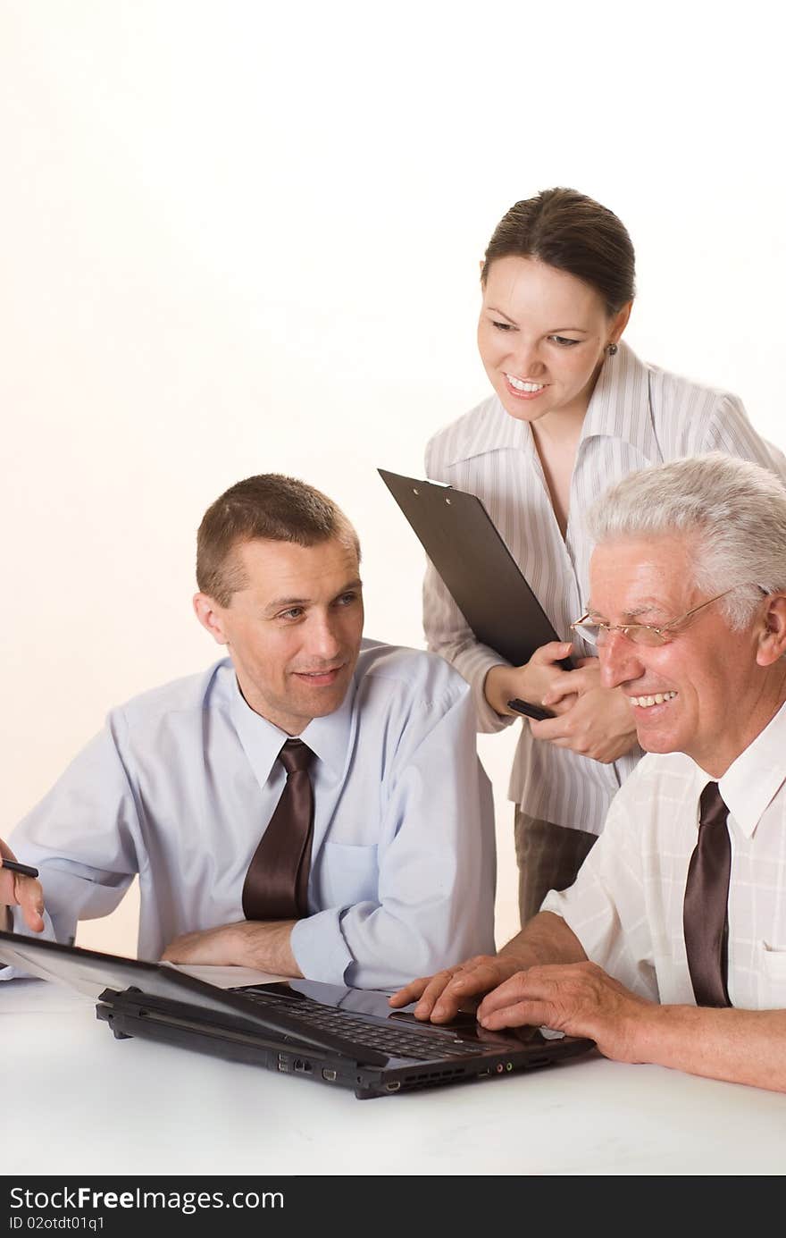 Two businessmen working together on a white