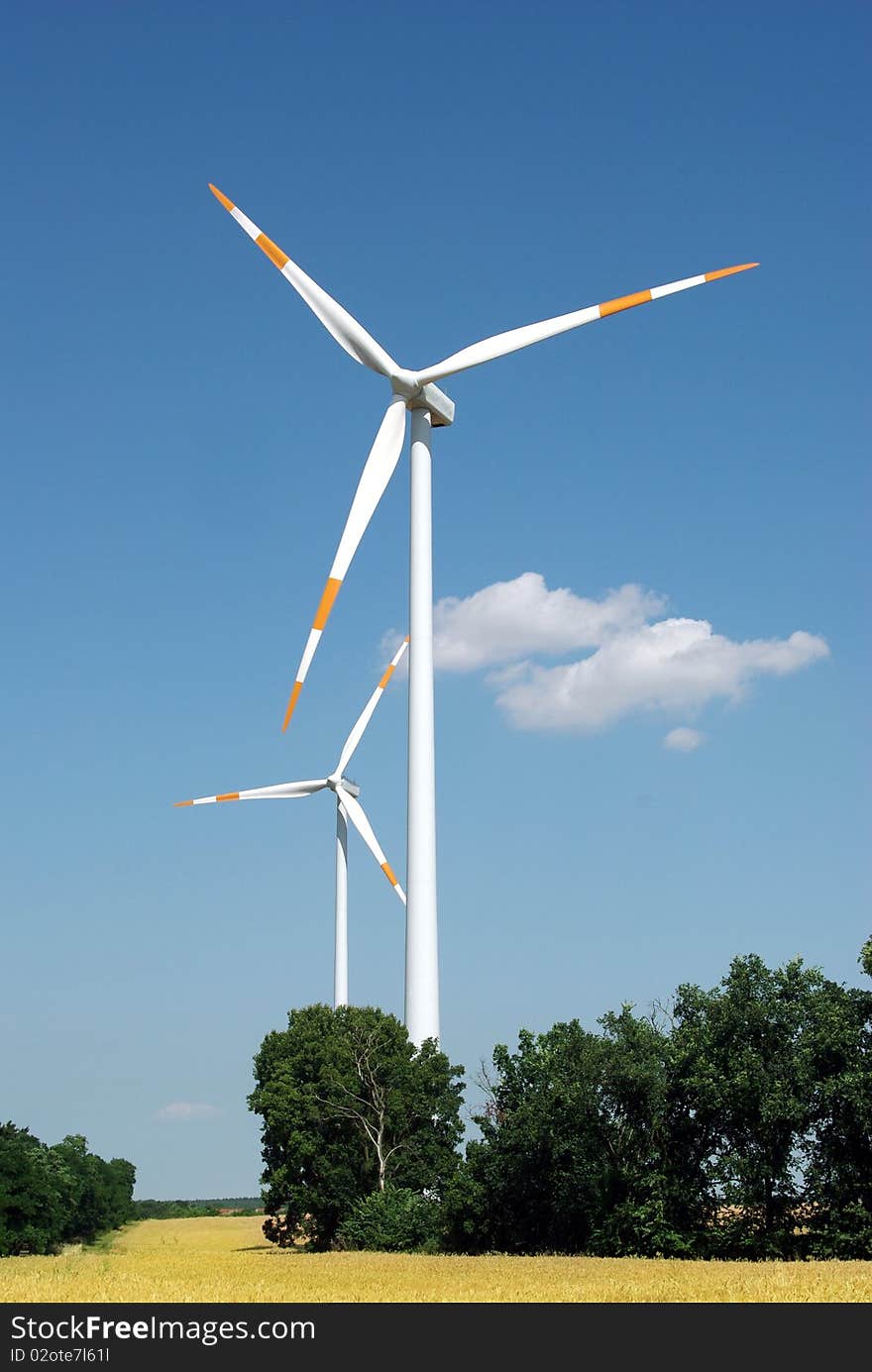 Wind turbine on blue sky background