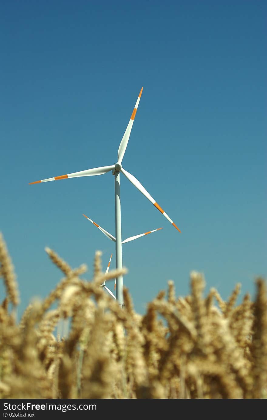 Wind turbine on blue sky background. Wind turbine on blue sky background