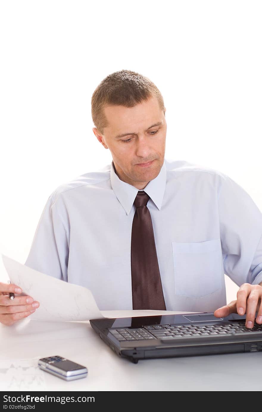 Businessman with laptop on white