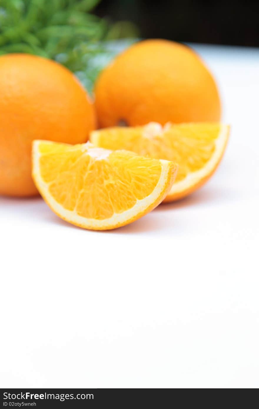 Quartered orange on a table. Quartered orange on a table