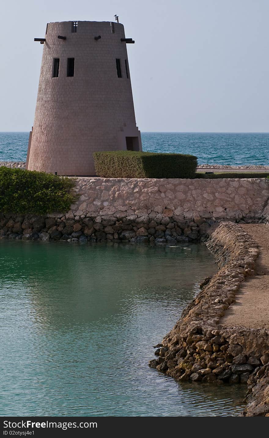 An old watchtower guards against an attack by sea in the Middle East. An old watchtower guards against an attack by sea in the Middle East.