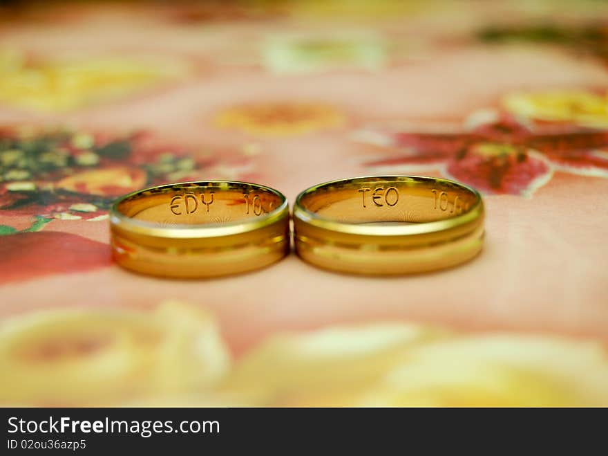 Two rings with initial engraved inside.