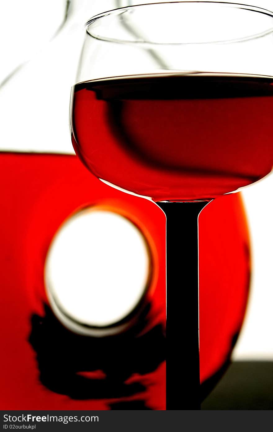 Abstract glassware background design made from a wine glass and bottle . Abstract glassware background design made from a wine glass and bottle .