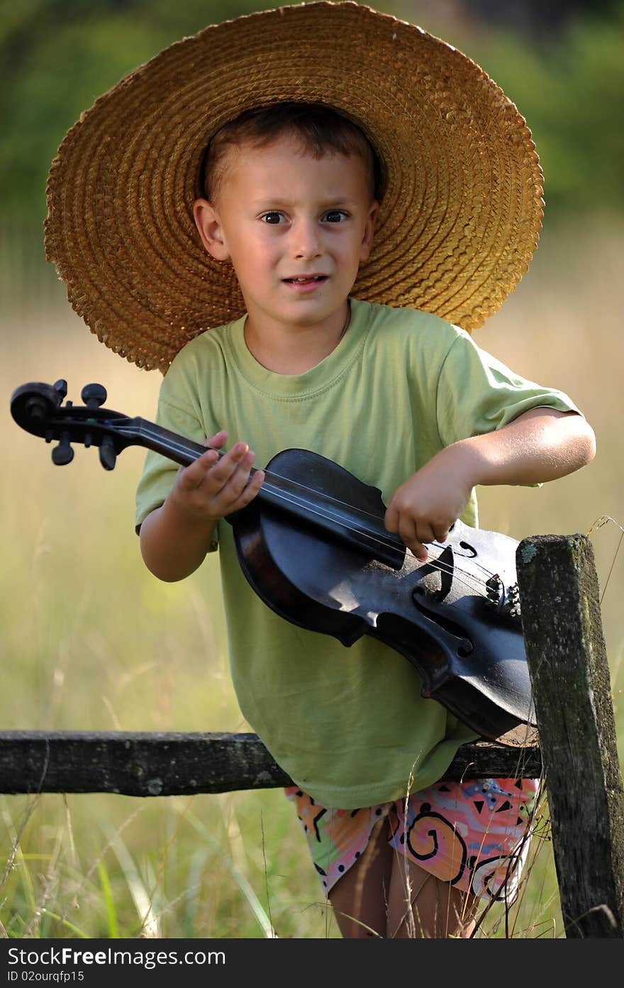 Portrait of a child playing the violin. Portrait of a child playing the violin