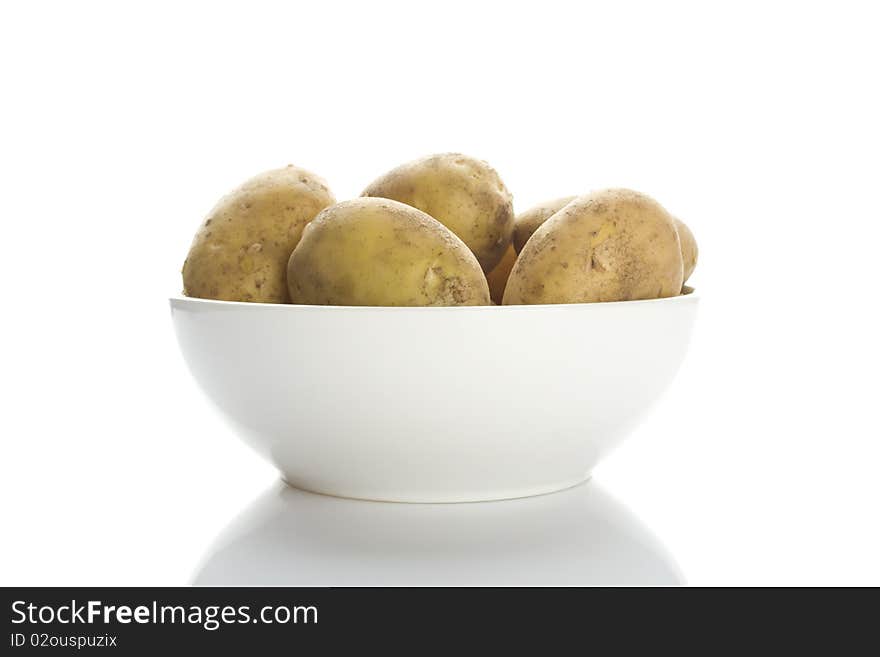 Potatoes in a white plate isolated on a white background