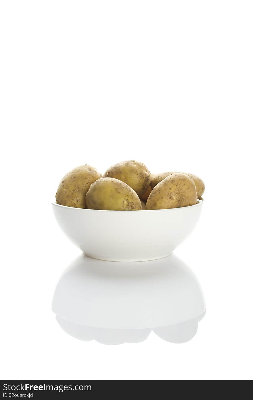 Potatoes in a white plate isolated on a white background