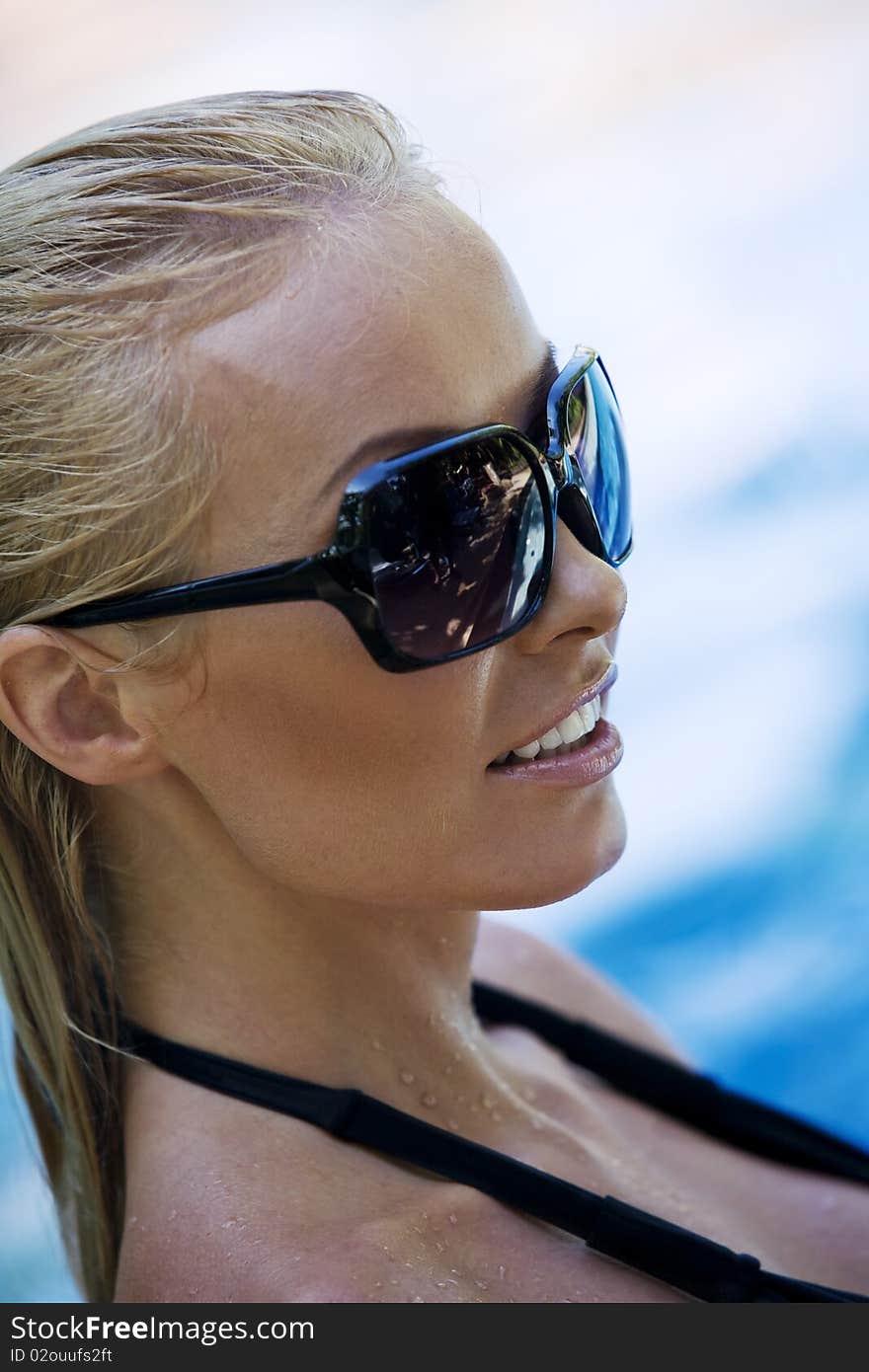 Portrait of young attractive woman having good time swimming pool. Portrait of young attractive woman having good time swimming pool