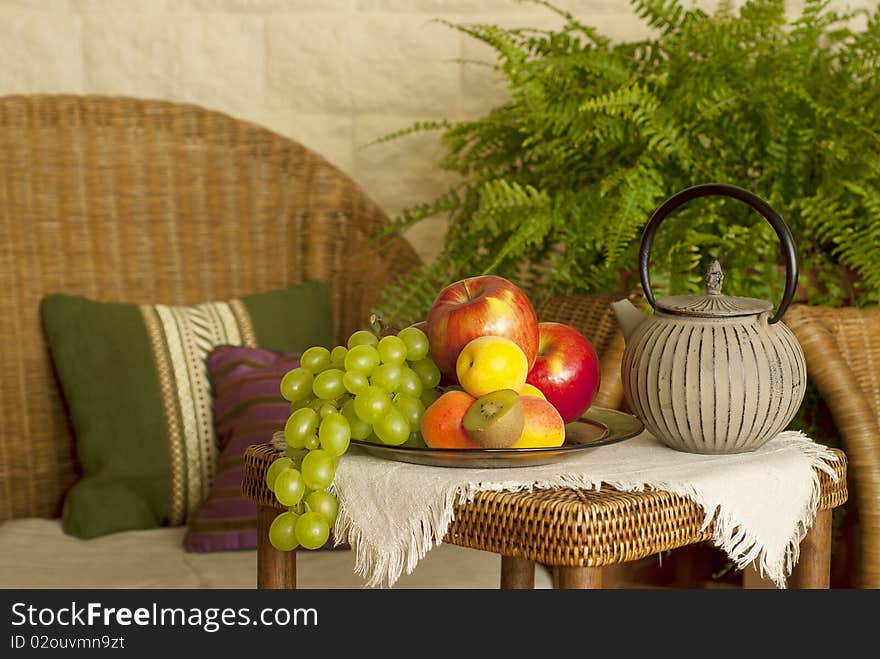 Beautiful still life image of fruits and teapot