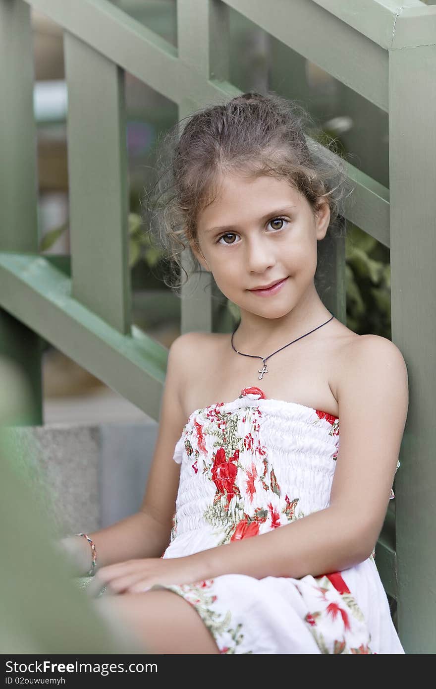 Portrait of nice little girl in summer environment