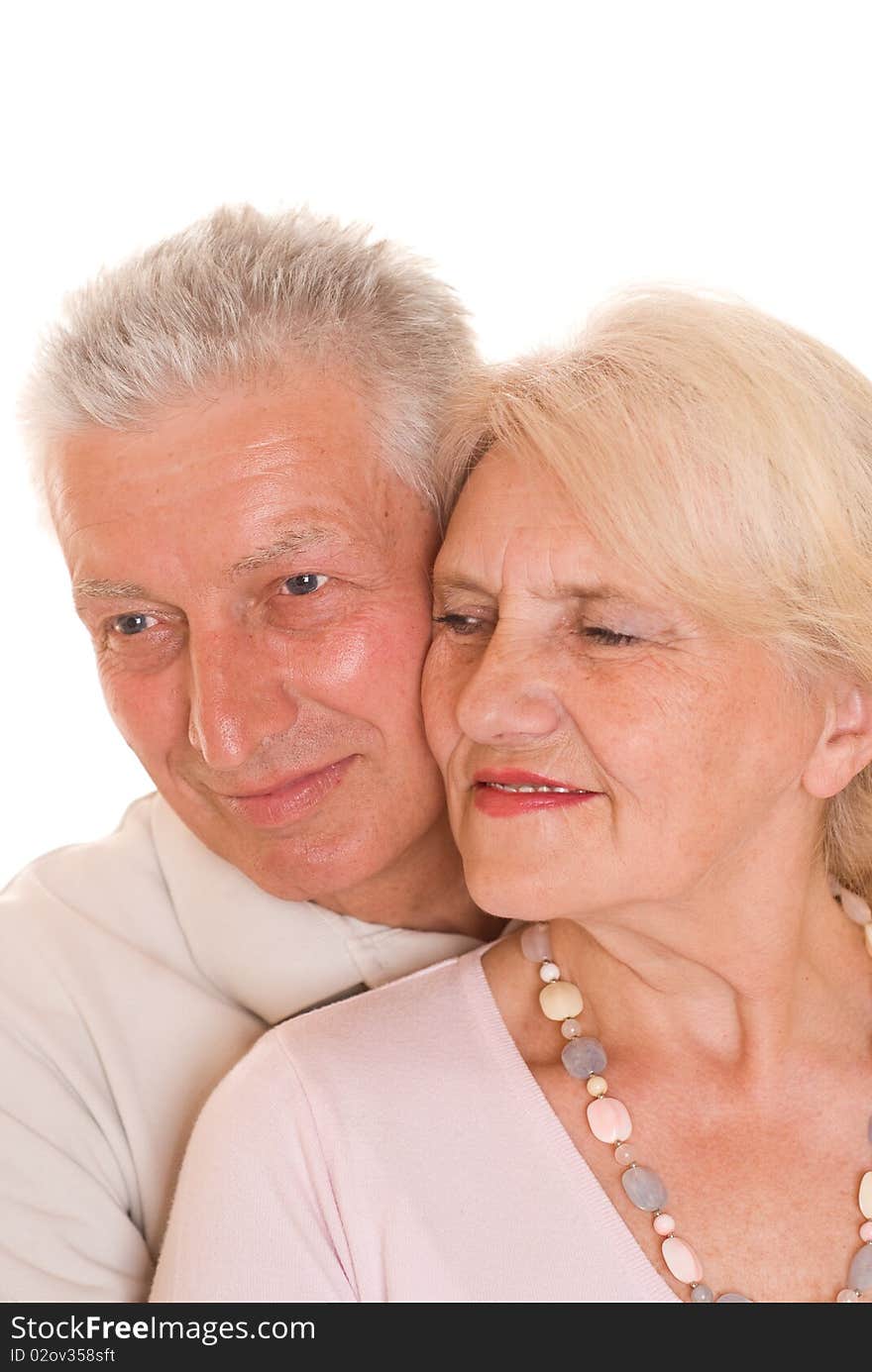 Elderly couple together on a white