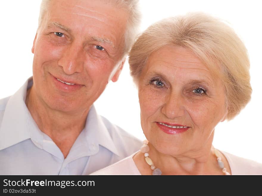 Elderly couple together on a white