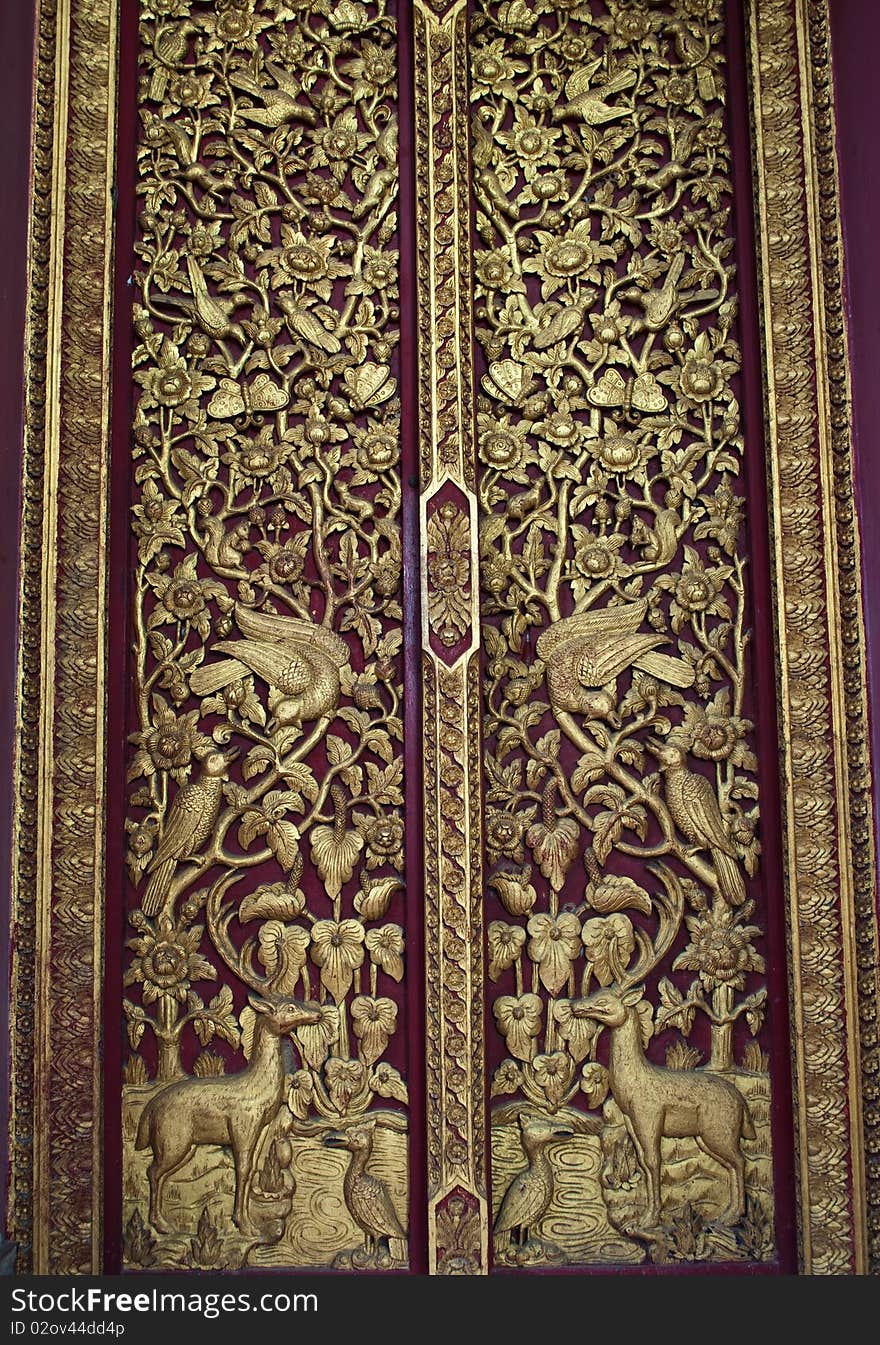 Traditional thai style wood carving on the door