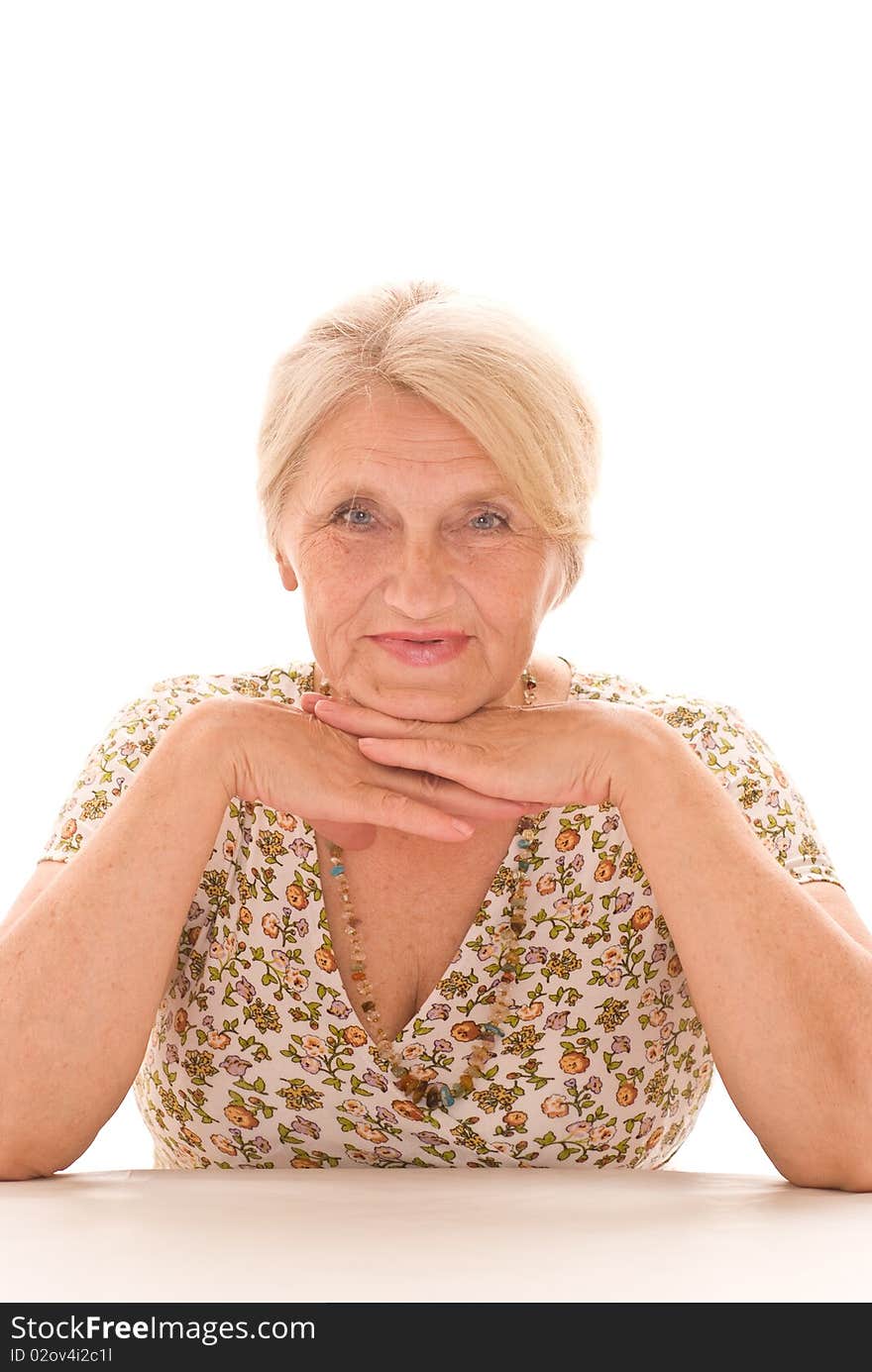 Beautiful older woman on a white background