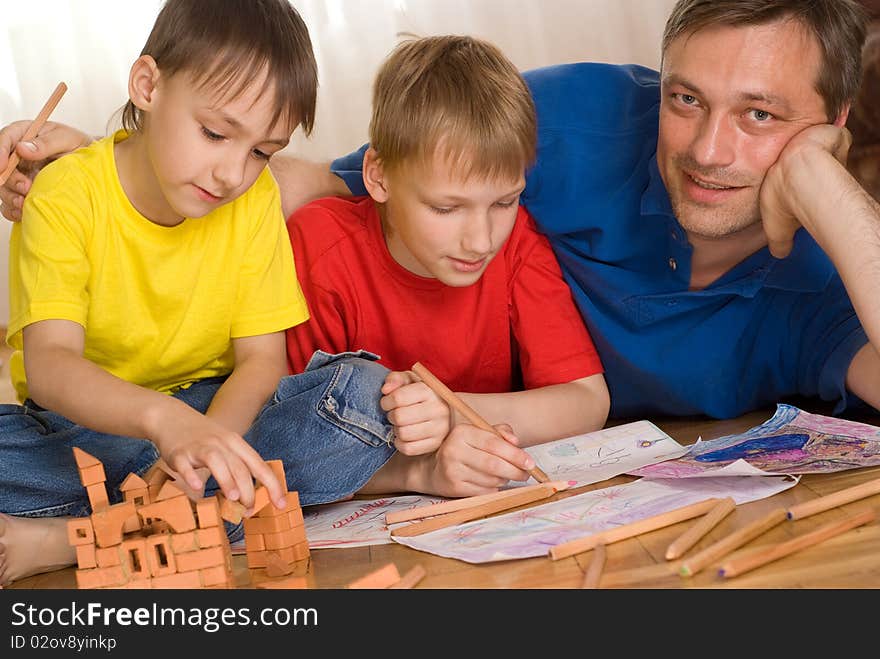 Father with children playing on the floor