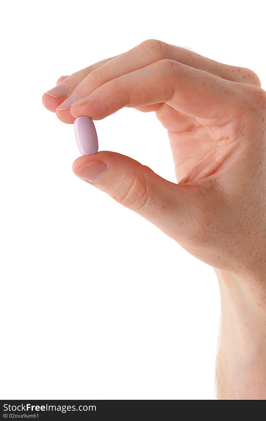 Male hand with pill over white background