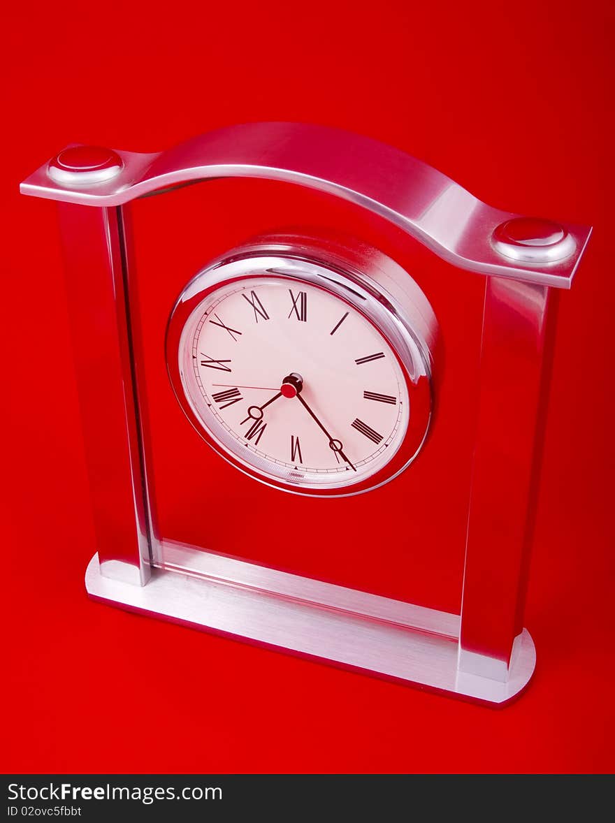 Mechanical clock on a red background