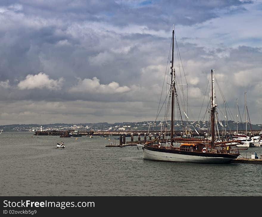 Yacht in harbour and sea view