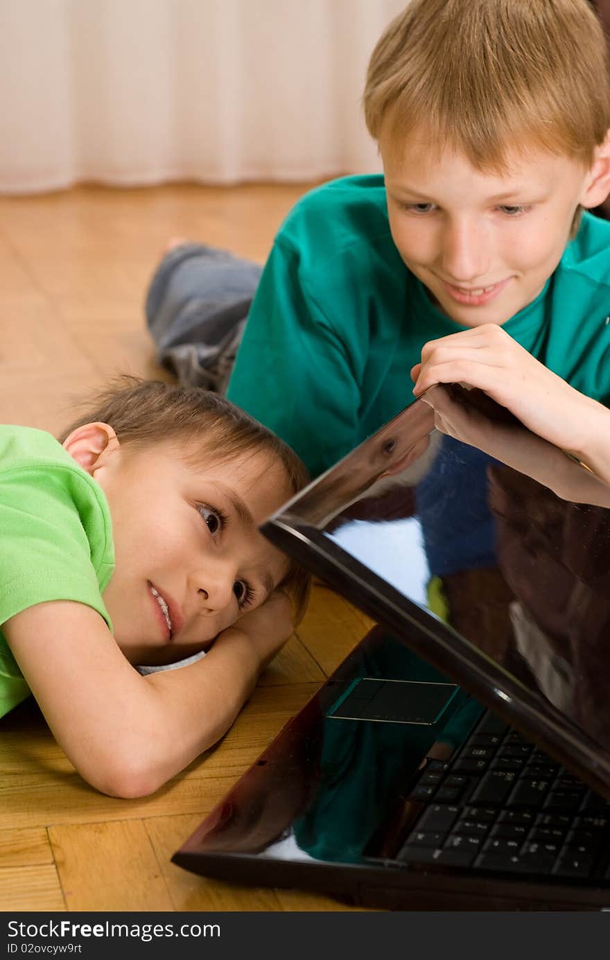 Brothers Lie  With Laptop