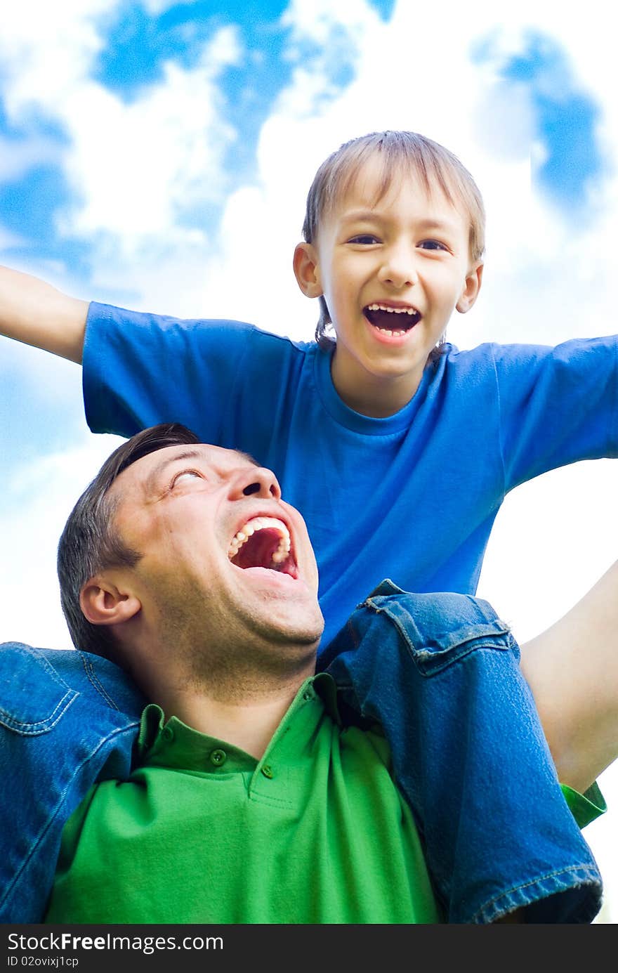 Happy father with his son in a park