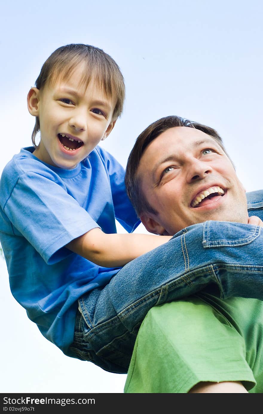 Happy father with his son in a park